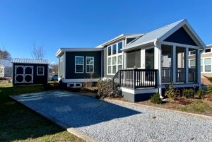 Front of tiny home with large tandem driveway