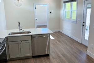 View of kitchen island and living/dinning room