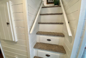 Stairs leading to loft with storage