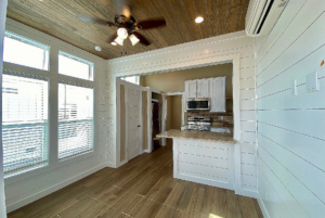 view of kitchen space and pantry from living space