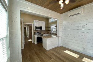 view of kitchen and eat in bar from the living room