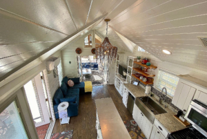 View of tiny home living space from loft