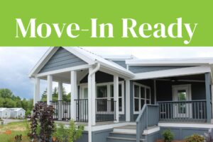 Blue-gray house with white trim and porch on Mount Meadow Lane under a green Move-In Ready banner.