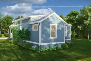 A small blue house with white trim sits in a green yard with shrubs, flowers, and trees under a sunny sky.