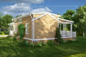 Single-story tan house with white trim, porch, and garden, surrounded by trees under a clear blue sky.