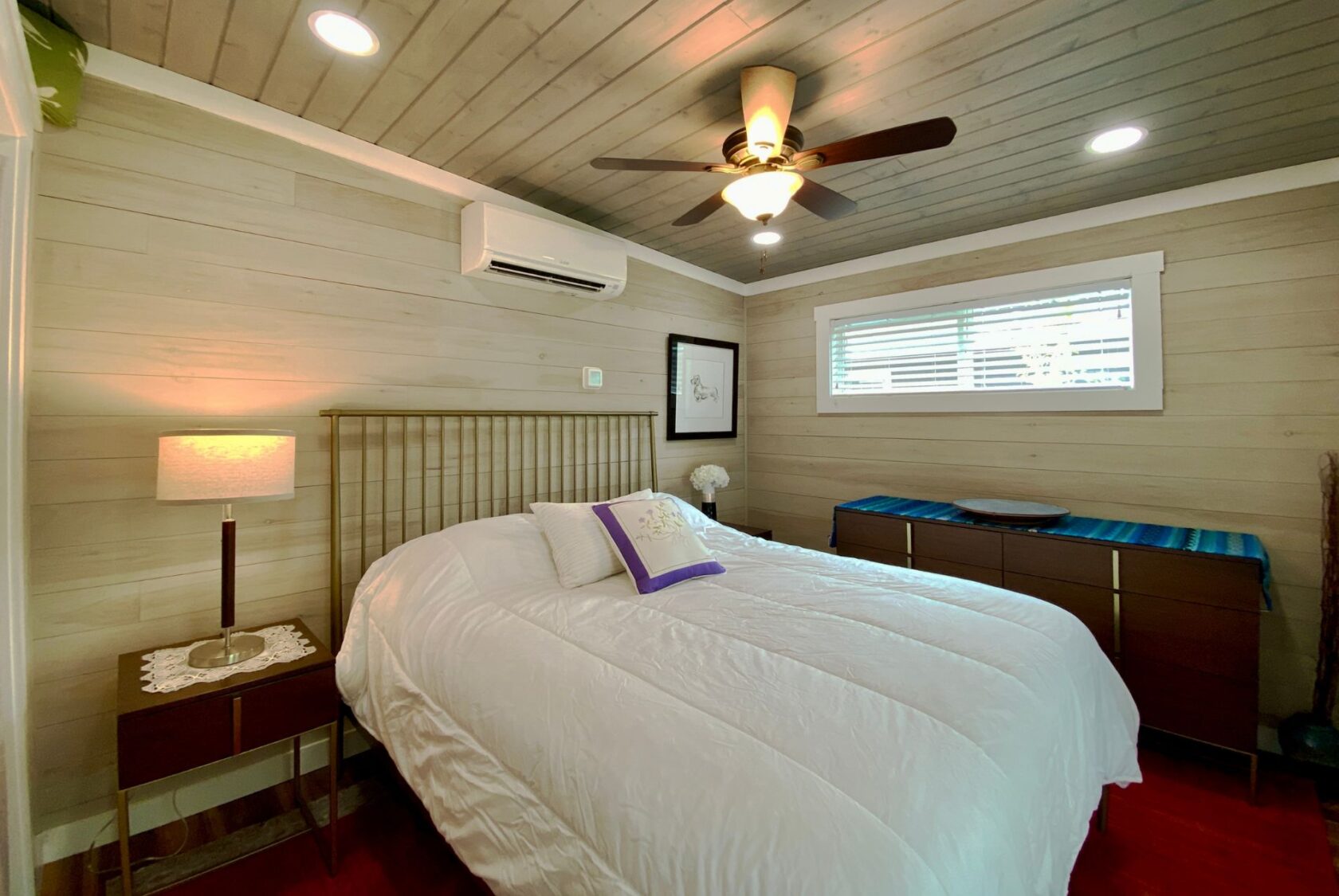 Cozy bedroom on Just Wandering Lane with a white bed, wooden ceiling, ceiling fan, dresser, and window blinds.