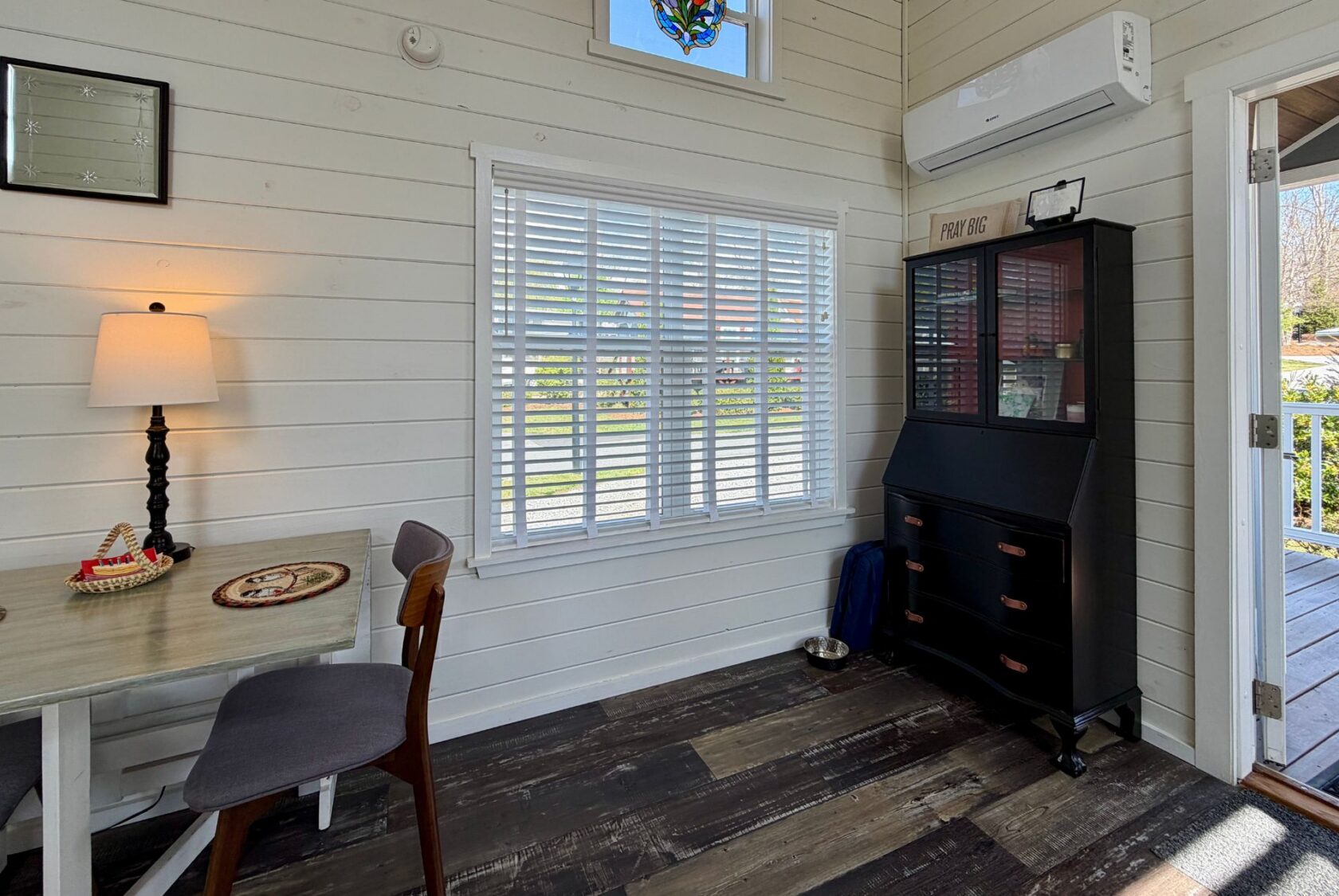 Small, bright room at 47 Drifting Brook Lane with a desk, chair, lamp, cabinet, and sunlit window—perfect for real estate tours.