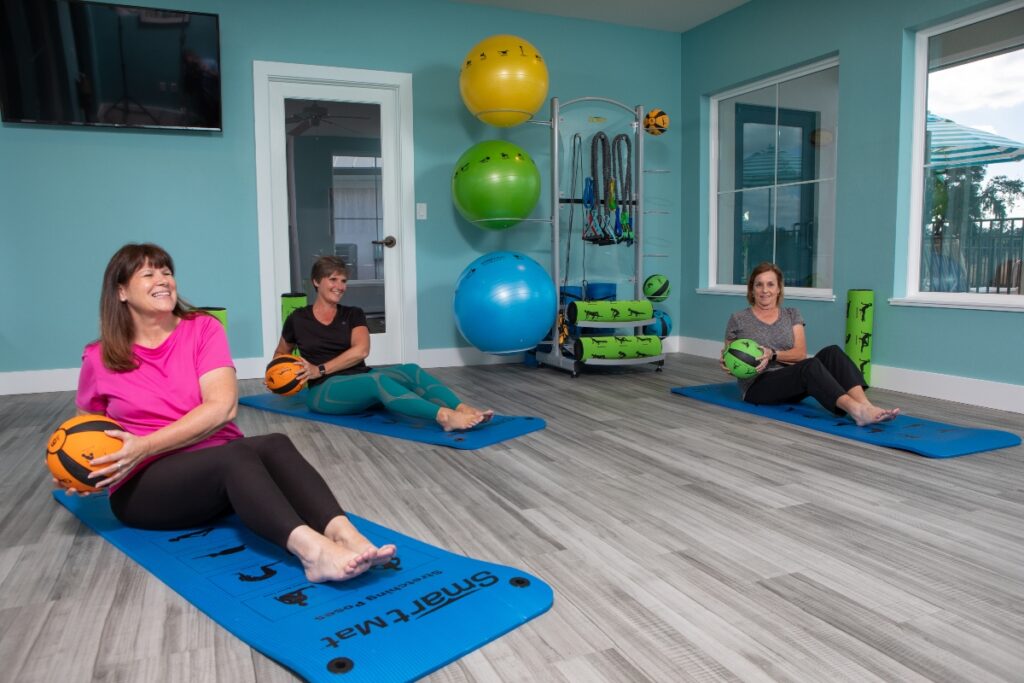Residents enjoying the yoga studio in our central Florida community.