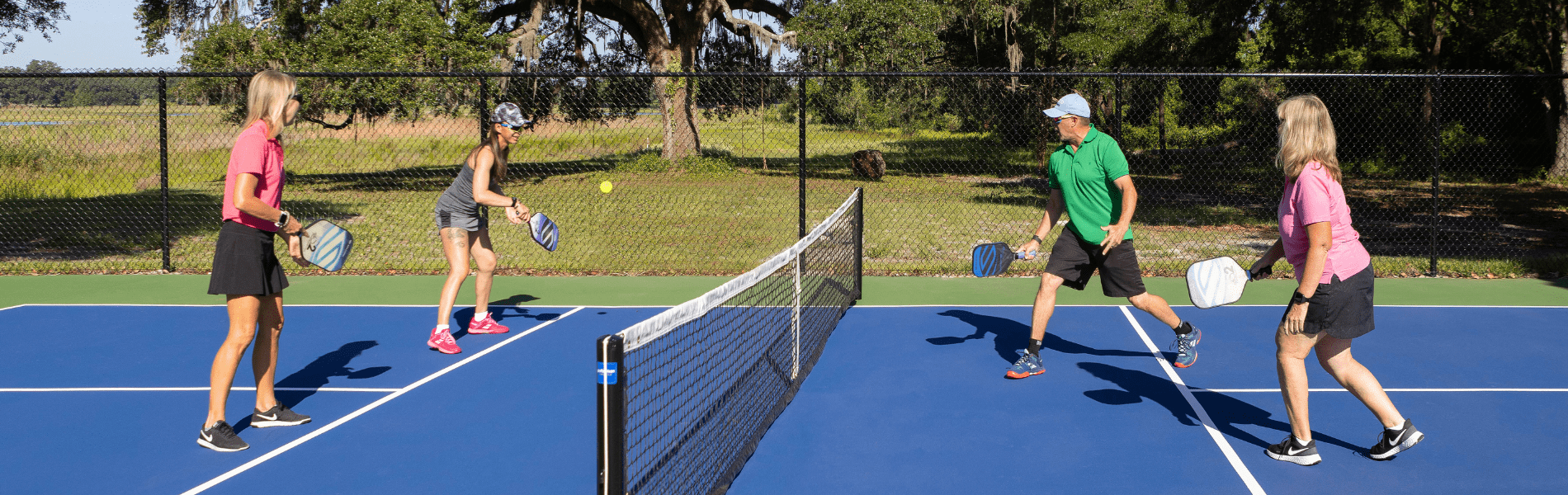 Residents at Lakeshore enjoy playing pickleball on the community courts.